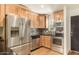 Modern kitchen featuring stainless steel appliances and wood cabinets at 4800 N 68Th St # 264, Scottsdale, AZ 85251