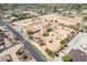 Aerial view showing house, pool, and surrounding desert landscape at 4832 W Saguaro Park Ln, Glendale, AZ 85310