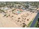 Aerial view of a house, pool and large lot in a quiet neighborhood at 4832 W Saguaro Park Ln, Glendale, AZ 85310