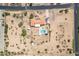 An aerial view of a property featuring a house and pool at 4832 W Saguaro Park Ln, Glendale, AZ 85310