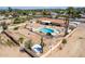 Aerial view showing home, pool, and expansive desert landscape at 4832 W Saguaro Park Ln, Glendale, AZ 85310