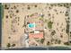 Aerial view of property with house and pool, surrounded by desert landscape at 4832 W Saguaro Park Ln, Glendale, AZ 85310