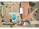 Aerial view showcasing a home, pool, and expansive desert lot at 4832 W Saguaro Park Ln, Glendale, AZ 85310