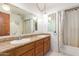 Bathroom boasts double sinks and a shower/tub combo at 4832 W Saguaro Park Ln, Glendale, AZ 85310