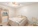 Bedroom with floral bedding and a comfortable chair at 4832 W Saguaro Park Ln, Glendale, AZ 85310