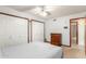 Bright bedroom with double closets and ceiling fan at 4832 W Saguaro Park Ln, Glendale, AZ 85310