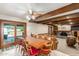 Farmhouse style dining area with wood ceiling beams at 4832 W Saguaro Park Ln, Glendale, AZ 85310