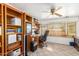 Bright home office with built-in shelving and window seat at 4832 W Saguaro Park Ln, Glendale, AZ 85310