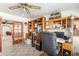 Home office with ample desk space and built-in shelving at 4832 W Saguaro Park Ln, Glendale, AZ 85310