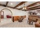 Living room with stone fireplace and vaulted ceiling at 4832 W Saguaro Park Ln, Glendale, AZ 85310