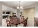 Elegant dining room featuring a wood table and chandelier at 4914 W Comanche Dr, Eloy, AZ 85131