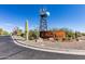 Robson Ranch entrance sign with windmill and landscaping at 4914 W Comanche Dr, Eloy, AZ 85131