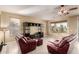 Living room with leather sofas and a built-in entertainment center at 4914 W Comanche Dr, Eloy, AZ 85131