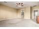 Main bedroom with carpet, ceiling fan, and en-suite bathroom at 4914 W Comanche Dr, Eloy, AZ 85131