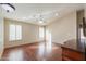 Bright bedroom with hardwood floors and a ceiling fan at 498 N Santiago Trl, Casa Grande, AZ 85194