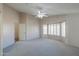 Bright bedroom featuring carpet, ceiling fan and bay window at 498 N Santiago Trl, Casa Grande, AZ 85194