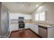 Kitchen with white cabinets and stainless steel appliances at 498 N Santiago Trl, Casa Grande, AZ 85194