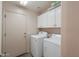 Laundry room with washer, dryer, and cabinets at 498 N Santiago Trl, Casa Grande, AZ 85194