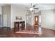 Living room with hardwood floors and a built-in entertainment center at 498 N Santiago Trl, Casa Grande, AZ 85194