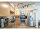 Modern kitchen with stainless steel appliances and ample counter space at 602 N May St # 47, Mesa, AZ 85201