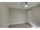 Simple bedroom with ceiling fan and tile flooring at 6323 N 65Th Dr, Glendale, AZ 85301