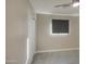 Well-lit bedroom with double door closet and ceiling fan at 6323 N 65Th Dr, Glendale, AZ 85301