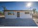 Newly renovated single story home with a modern facade and gated front yard at 6323 N 65Th Dr, Glendale, AZ 85301