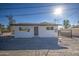 Newly renovated single story home with a modern facade and gated front yard at 6323 N 65Th Dr, Glendale, AZ 85301