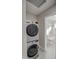 Stackable washer and dryer in a compact laundry room at 6323 N 65Th Dr, Glendale, AZ 85301