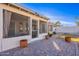 Covered screened patio with brick pavers and potted plants at 6340 W Ironwood Dr, Glendale, AZ 85302