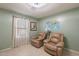 Relaxing sitting room with two armchairs and a world map at 6340 W Ironwood Dr, Glendale, AZ 85302