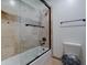 Clean bathroom with shower/tub combo and updated fixtures at 6502 N 81St Pl, Scottsdale, AZ 85250