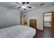 Serene bedroom with a queen-size bed and access to a closet at 6502 N 81St Pl, Scottsdale, AZ 85250