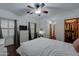 Bright bedroom with double sinks, walk-in closet, and plantation shutters at 6502 N 81St Pl, Scottsdale, AZ 85250