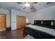 Spacious bedroom with a king-size bed and built-in wooden closet at 6502 N 81St Pl, Scottsdale, AZ 85250