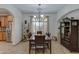 Elegant dining room with a large window and a beautiful chandelier at 6502 N 81St Pl, Scottsdale, AZ 85250