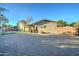 Home exterior with a large paved driveway and gated entry at 6502 N 81St Pl, Scottsdale, AZ 85250