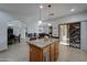 Well-equipped kitchen with island, granite counters and stainless steel appliances at 6502 N 81St Pl, Scottsdale, AZ 85250