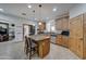 Open kitchen with island seating, granite countertops, and stainless steel appliances at 6502 N 81St Pl, Scottsdale, AZ 85250