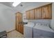 Laundry room with washer, dryer, and ample cabinet space at 6502 N 81St Pl, Scottsdale, AZ 85250