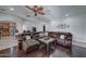 Comfortable living room features a large sectional sofa, wood floors, and access to the kitchen at 6502 N 81St Pl, Scottsdale, AZ 85250