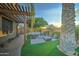 Relaxing backyard patio with pergola and fire pit at 6502 N 81St Pl, Scottsdale, AZ 85250