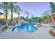 Expansive swimming pool and spa with a rock waterfall at 6502 N 81St Pl, Scottsdale, AZ 85250