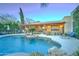 Resort-style pool with a covered patio and lounge chairs at 6502 N 81St Pl, Scottsdale, AZ 85250