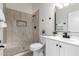 Updated bathroom with a walk-in shower, modern vanity, and stylish tile at 6820 N 81St Ln, Glendale, AZ 85303