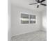 Bedroom with large window and tile floor at 6820 N 81St Ln, Glendale, AZ 85303