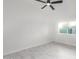 Bright bedroom with ceiling fan and tile floor at 6820 N 81St Ln, Glendale, AZ 85303