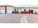 Brick home with a landscaped yard and two-car garage at 6820 N 81St Ln, Glendale, AZ 85303