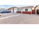 Landscaped front yard with a brick home and driveway at 6820 N 81St Ln, Glendale, AZ 85303