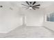 Bright living room with tile floors and ceiling fan at 6820 N 81St Ln, Glendale, AZ 85303